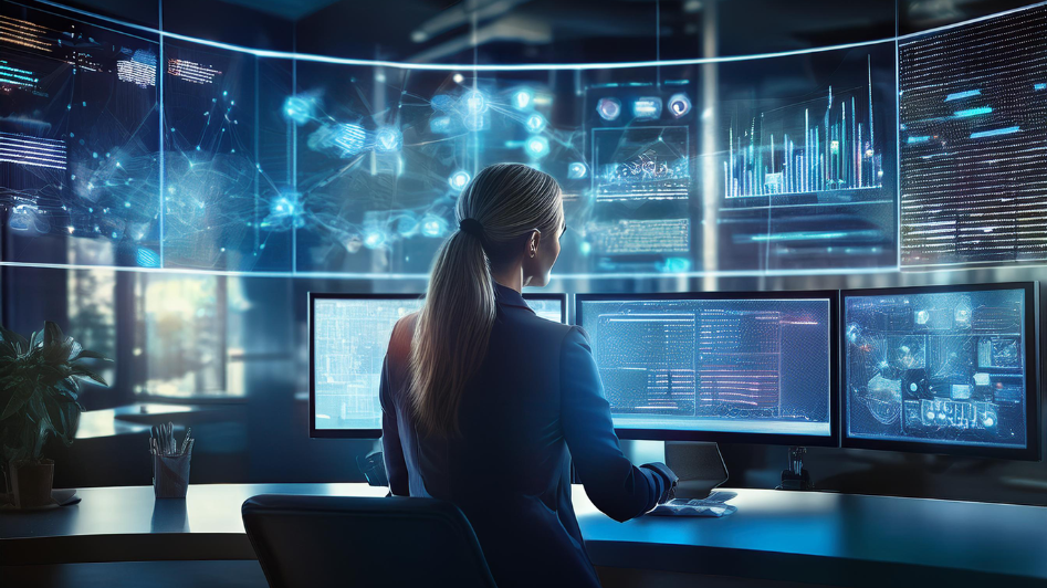 A businesswoman using multiple screens with AI-powered tools and data analytics in a modern office, showcasing the integration of AI and automation in business operations.