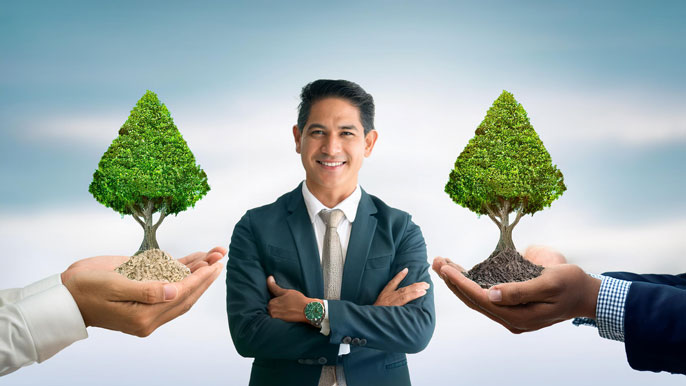 A confident entrepreneur stands between two hands holding small trees, symbolizing the support from sponsors, coaches, and mentors in nurturing business growth and success.