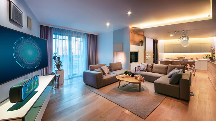 Smart home living room equipped with IoT-enabled devices, including smart lights, a voice-controlled assistant, and a smart thermostat, creating a seamless and connected lifestyle.