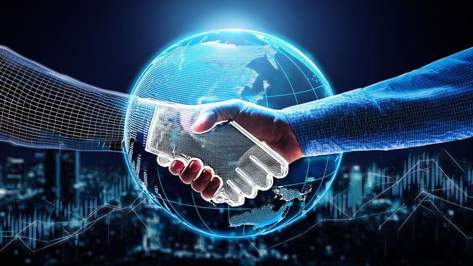 A glowing handshake between a real and digital hand, set against a globe, symbolizing international business partnerships and global collaboration.